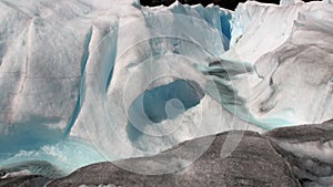 Power water of creek in snowy mountains and glacier in Antarctica.