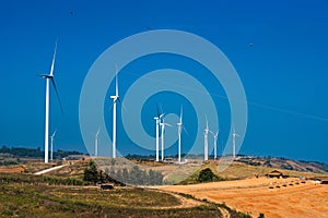 .Power of wind turbine generating electricity clean energy with cloud background on the blue sky.Global ecology.Clean energy