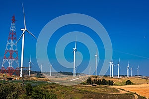 .Power of wind turbine generating electricity clean energy with cloud background on the blue sky.Global ecology.Clean energy
