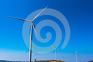 .Power of wind turbine generating electricity clean energy with cloud background on the blue sky.Global ecology.Clean energy