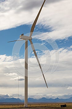 Power of wind turbine generating electricity clean energy with cloud background on the sky.Global ecology