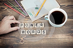 Power Words. Wooden letters on the office desk