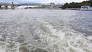 Powerboat moving. view from stern of ship with water foam and surface behind. Motor boat floating on Moscow river