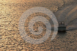 Powerboat at sunset