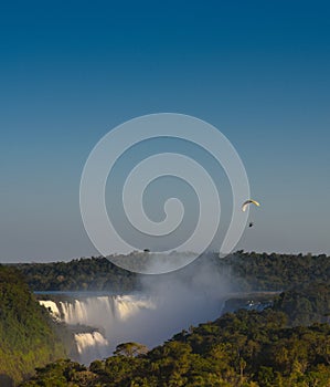 Powered Parachute at sunset over Iguasu Falls, Argentina Brazil