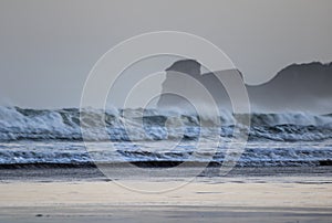 Powerful breaking waves on surf spot in hendaye in winter morning sunrise, basque country, france