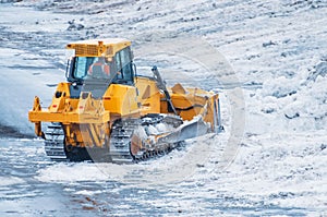 Powerful bulldozer for snow removal after snowfall