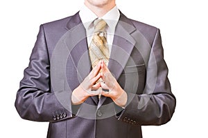 Powerful businessman folds hands together