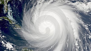 A Powerful Category Hurricane Dominates the Atlantic Ocean, Showcasing a Defined Eyewall and Outer Rain Bands photo
