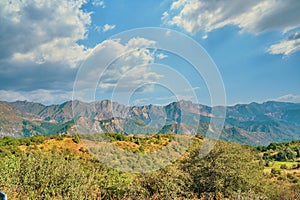 Powerful clouds over mountains and hills