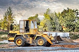 Powerful crawler bulldozer close-up at the construction site. Construction equipment for moving large volumes of soil. Modern