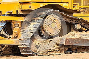 Powerful crawler bulldozer close-up at the construction site. Construction equipment for moving large volumes of soil. Modern