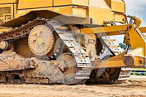 Powerful crawler bulldozer close-up at the construction site. Construction equipment for moving large volumes of soil. Modern