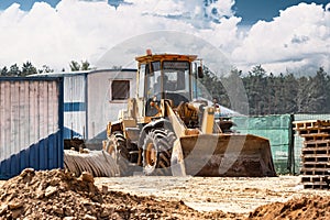 Powerful crawler bulldozer close-up at the construction site. Construction equipment for moving large volumes of soil. Modern