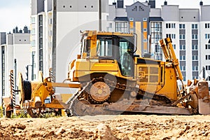 Powerful crawler bulldozer close-up at the construction site. Construction equipment for moving large volumes of soil. Modern