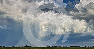 Powerful cumulonimbus clouds eksploading in the sky