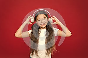 Powerful effect music teenagers their emotions, perception of world. Girl listen music headphones on red background