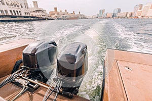 powerful engines at the stern of a cruise ferry boat in the Creek Dubai Canal area overlooking the Deira area