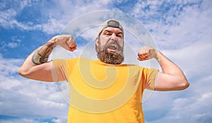 Powerful and free. Man bearded muscular brutal hipster outdoors sky background. Masculinity and brutality. Lumbersexual