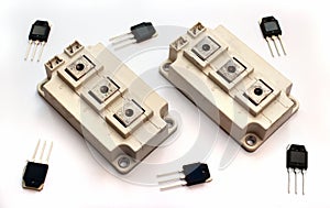 Powerful IGBT transistor modules and small transistors on white