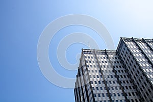 Powerful image of an office skyscraper with a clear sky