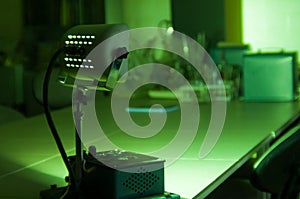 Powerful industrial green laser equipment in a laboratory