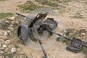 Powerful Military machine gun. Medieval cannon or machinegun on platform in battle field