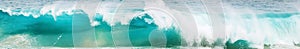 Powerful ocean blue waves with white foam. Marine background. Banner format.