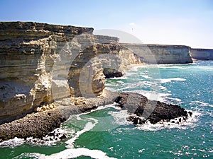 Powerful ocean waves meet a dramatic rocky coastline, creating a stunning and awe-inspiring scene