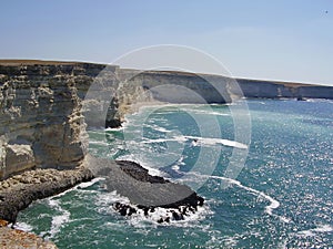 Powerful ocean waves meet a dramatic rocky coastline, creating a stunning and awe-inspiring scene