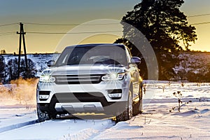Powerful offroader car view on winter background
