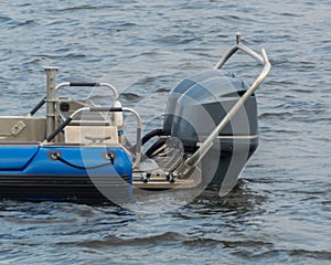 Powerful outboard motors at the stern of the speed boat.