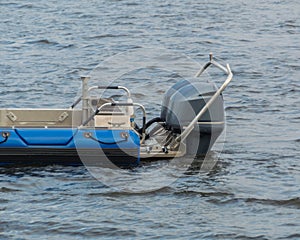 The powerful outboard motors at the stern of the speed boat