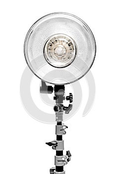 Powerful photo flash lamp on rack on white background in studio