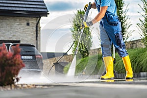 Powerful Pressure Washer Using to Clean Dirty Driveway