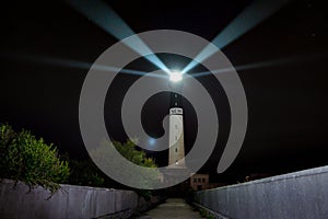 Powerful Sein island lighthouse at night
