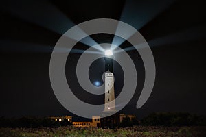 Powerful Sein island lighthouse at night
