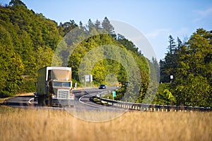 Powerful semi truck cornering scenic highway