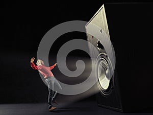 Powerful sound wave with funny sound speaker and screaming man. photo
