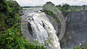 A powerful stream collapses from the edge of the plateau into the gorge. photo