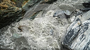 Powerful Stream of River Flowing Across Marble Rocks at Taroko Gorge National Park in Taiwan