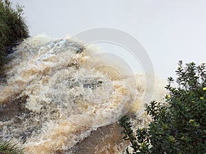 A powerful stream of river rushing into the abyss in the Iguazu national Park in Argentina, South America