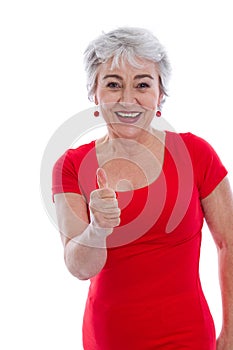 Powerful and successful older woman - thumbs up isolated.