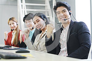 Powerful and Sucessful of Business group Call Center and technical Support staff for receptionist phone operator. Asian customer photo