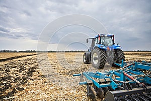 Powerful tractor working in a field