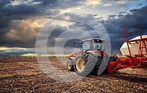 A powerful tractor works in the field