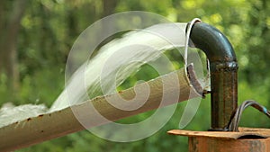 Powerful Water Flowing from a Pipe Pump.