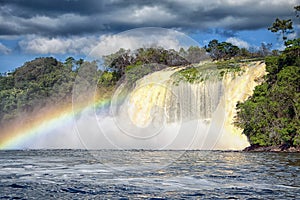 Powerful waterfall and rainbow