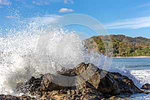 Powerful Wave Crashing into a Rock