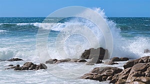 Powerful wave splashing against rocks on the Atlantic coast of Portugal in summer